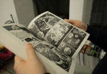 The Ongoing War Against Manga Piracy: Top Legal Alternatives and Industry Efforts A person clutches a comic book, featuring eye-catching graphics.