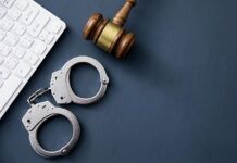 Fines, Lawsuits, and Jail Time: What Happens if You Get Caught Watching Illegal Sports Streams? A computer keyboard with handcuffs and a judge’s gavel.