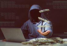 How to Know if Your Identity’s Been Stolen shadowy figure in hoody with laptop tosses cash in air