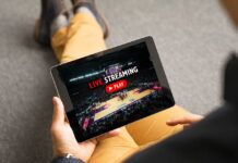 How Crackdowns on Illegal Sports Streaming Are Changing the Industry Man watching sports on live streaming online service
