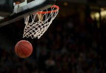 How to Safely Watch Every Game of the 2025 NBA Playoffs A basketball swishing through a basketball hoop.