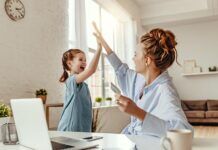 Protect Your Family with These Six Safe Streaming Tips young girl and mother high five in front of laptop