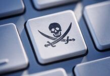The History of Online Piracy: A Timeline of Major Events A pirate symbol on a keyboard.