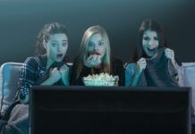 Scream and Stream: Why Horror Movies Are So Popular and Where To Watch Them Three women getting scared while watching a horror movie at home