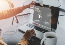 Understanding the Ethics of Digital Piracy: What You Need To Know Woman watching a movie she downloaded online via her laptop.